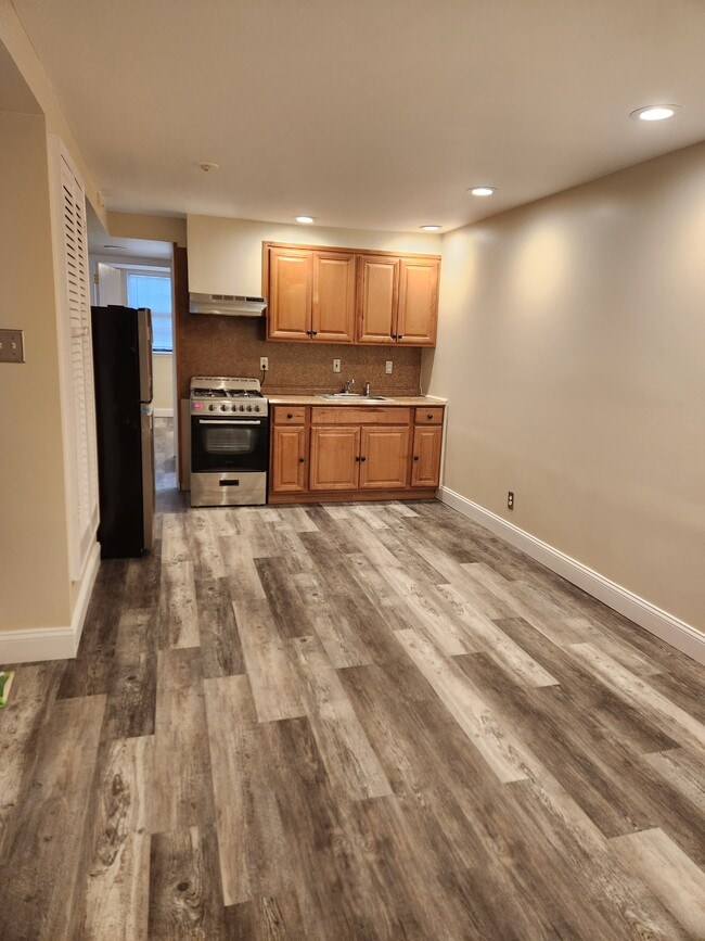 Living room into Kitchen view - 929 Federal St Unit 2R