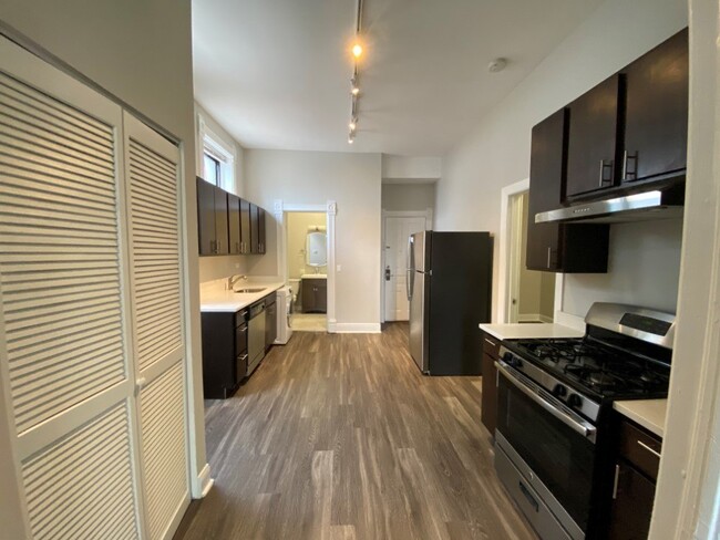 Large kitchen with plenty of cabinets for storage - 2346 W McLean Apartments