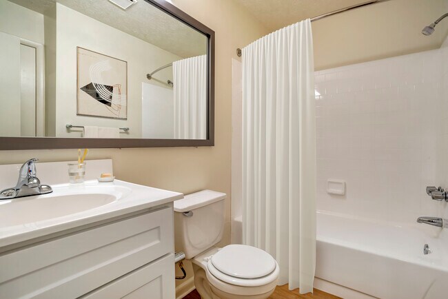 Upgraded Package II bath with white cabinetry and countertop
