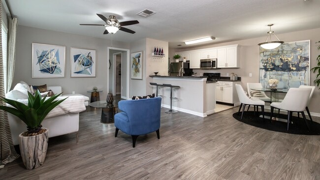 Revel in the airy openness of our floor plans with unblocked views across living spaces accentuated by sleek wood-style flooring.