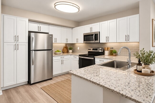 Elevate your living experience at Club Lake Pointe with our modern kitchen featuring sleek stainless steel appliances, ample cabinetry, and elegant granite countertops. This is the perfect space for culinary creativity. Schedule a tour today!