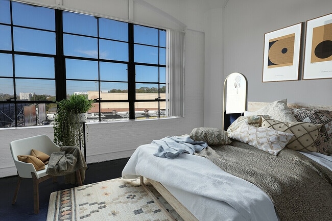 Factory window Bedroom With Tan bedding