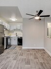 Experience style and comfort in this modern kitchen with an open living area.