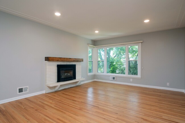 Living Room featuring refinished hardwood floors - 5206 Grandview Ln Townhome