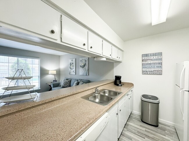 Large kitchen with island and premium appliances - Memorial City Apartments
