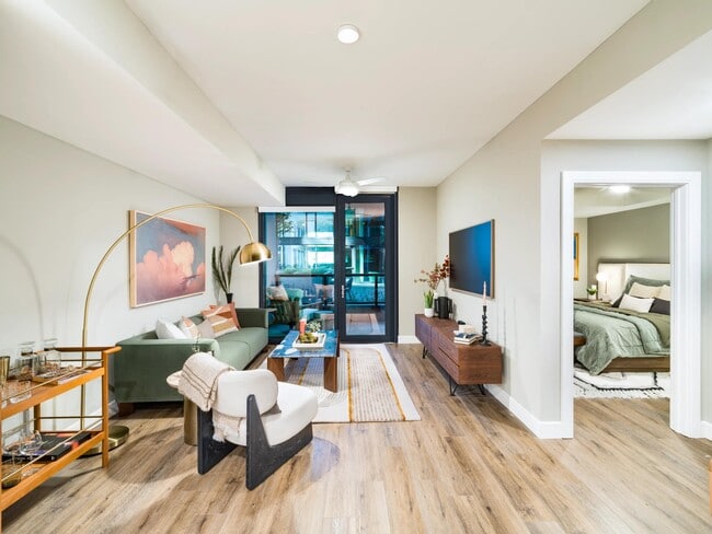 A bright, open living space at Modera McGavock, featuring warm finishes and easy flow, with downtown Nashville just a short drive away.