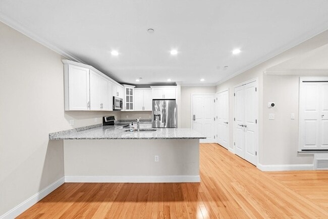 Photo - Top-Floor 2BR Condo with Balcony, Garage Parking & Amenities in Lexington Unit 244