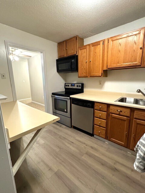 Kitchen w/ view of dining area - 100 Oxbow Dr Unit B2