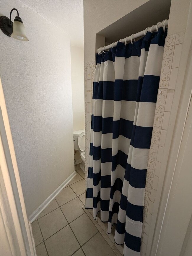 Photo - Ground Level 2 Bedroom, 2 Bath apartment. New flooring and paint. Tenant pays electric and natura...