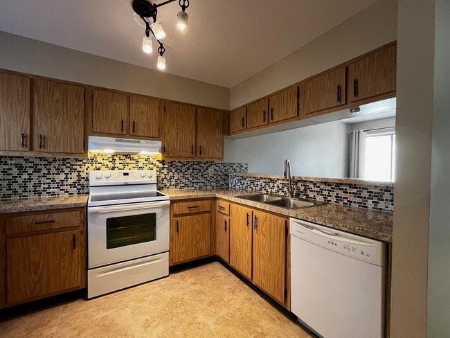 Kitchen showing tiled backsplash