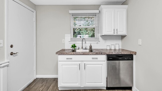 Ample cabinet storage, a dishwasher, and a bright, inviting design help make your kitchen a functional and welcoming space.