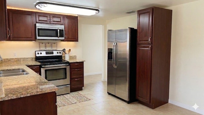 Photo - Updated 4-Bedroom Home for Rent in Pinellas Park | Spacious Layout | Stainless Steel Appliances