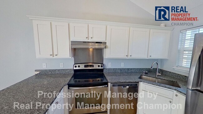 Photo - Immaculate 2 BD/2 BA Townhome with Open Floorplan and Split Bedrooms