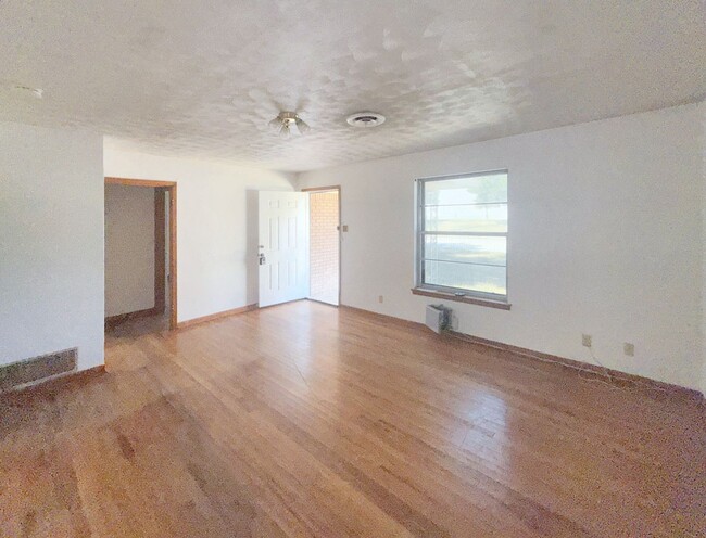 Photo - Cozy 3-Bedroom Brick Home with Covered Pat...