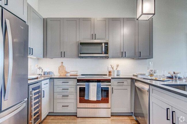 Kitchen with Wood-Style Flooring - Cortland Cap Hill Rental