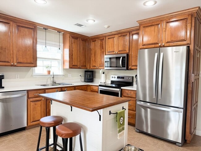 Photo - Spacious 3BR Home with Open Split Layout, Fenced Yard & Covered Front Porch