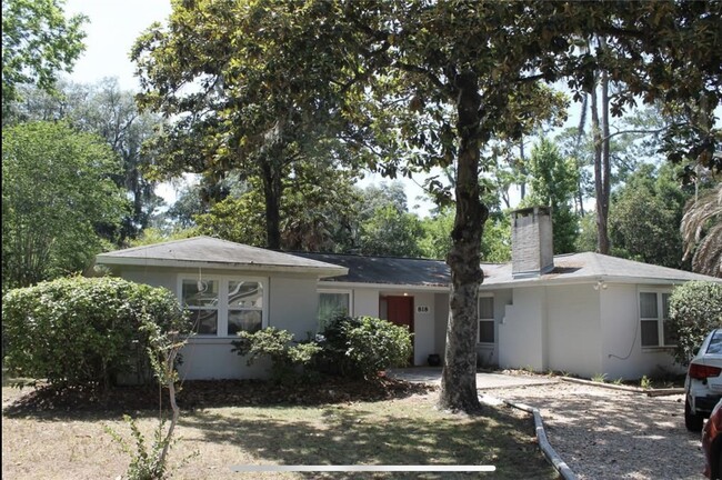 Exterior with round, gravel driveway - 818 NW 21st St House