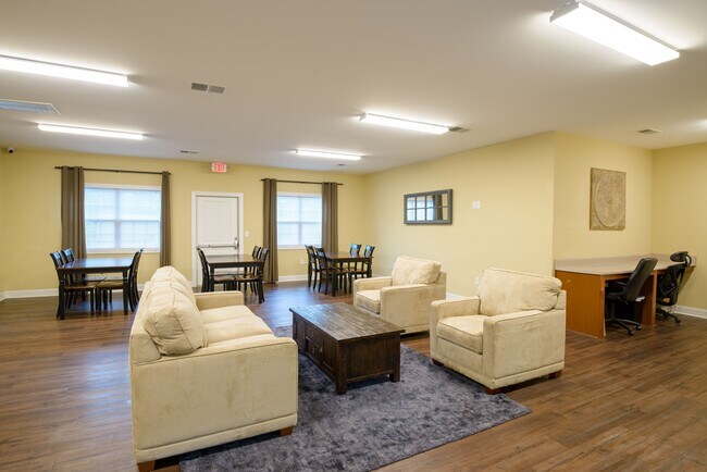 Relax and connect in our spacious resident lounge—perfect for gatherings, studying, or simply enjoying a quiet moment. - Timberland Park