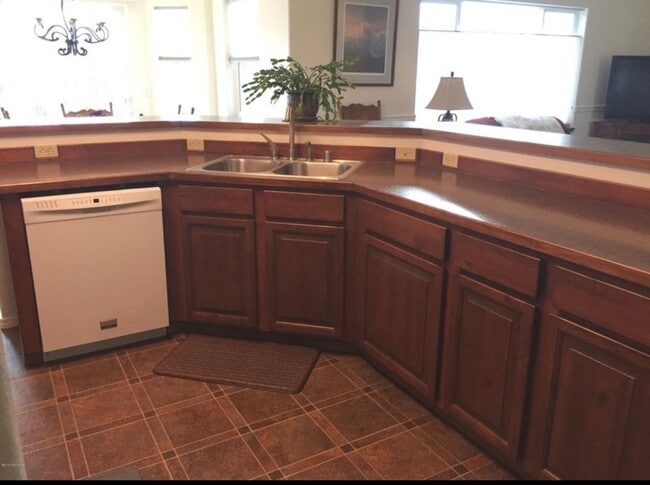 Photo - Ranch style 3 bedrooms with an office Plus a 3 car garage and large back yard complete with green...