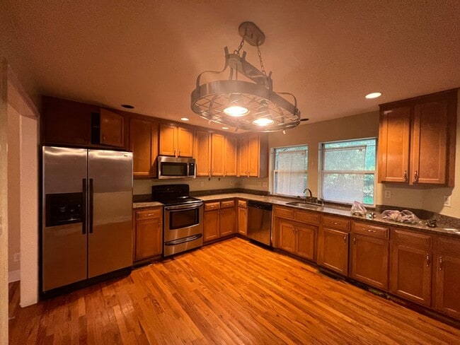 Photo - Massive 3 Bedroom 2.5 Bathroom Single-Family Home with Real Hardwood Floors and a Huge Two-Car Ga...