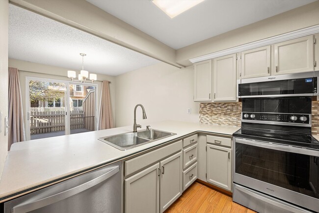 Photo - 3BR Townhome | Finished Basement | 2-Car Garage | Pool, Tennis & Pickleball