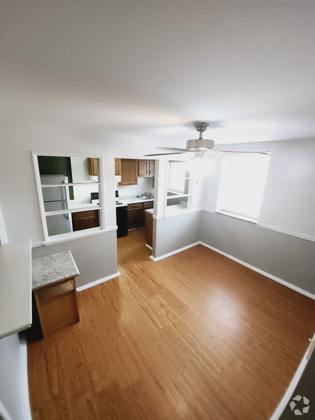 Dining room view into kitchen - 7629 Ivory Ave Unit 2F Rental