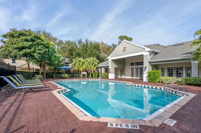 Swimming pool with lounge seating - Park Villas Apartments