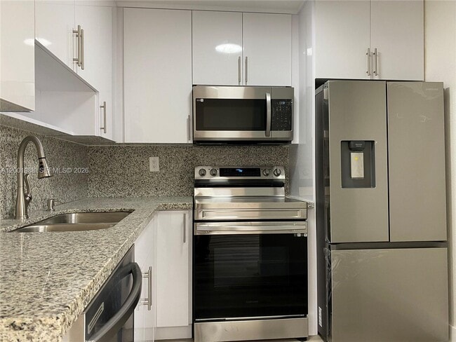 Building Photo - 9320 Fontainebleau Blvd Unit 301