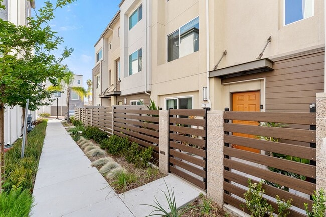 Building Photo - Modern Tri-Level Townhome in Gated Gardena Community with 2-Car Garag