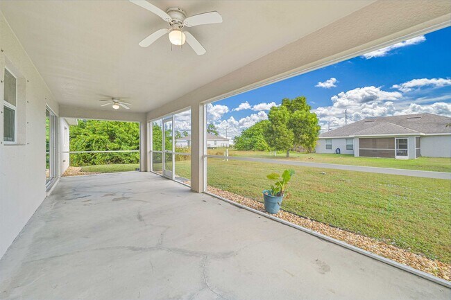 Photo - Spacious Three-Bedroom Home with Open Floor Plan, Large Yard & Screened Patio