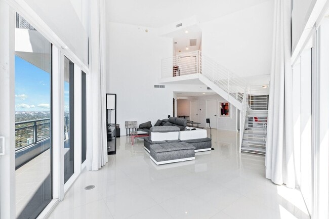 Photo - Stunning two-level 3 bedroom 4 bath corner unit with breathtaking panoramic views in center of Do...