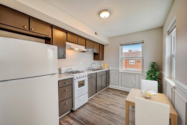Recently Renovated Townhouse Style Apartments featuring New gray carpet, Neutral paint scheme, Premium hardwood-style flooring, Neutral paint scheme, Upgraded light fixtures, New cabinets, Matching stainless steel appliances, Washer/Dryer, Air conditioning, Heating, New bathroom vanity, Marble tub s