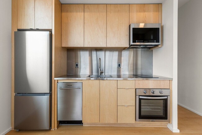 Building Photo - 7480 N Delaware Ave Unit 204