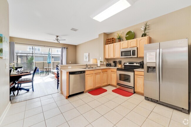 kitchen and great room/pool access 1st fl - 7663 Sir Kaufmann Ct Rental