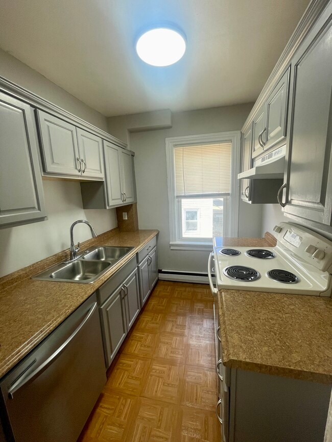 Kitchen, newly painted cabinets. - 44 Pine St Unit #2