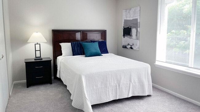 Relax in cozy bedrooms with ample space for furnishings and natural light from large windows, professionally operated by Highlands Vista Group.