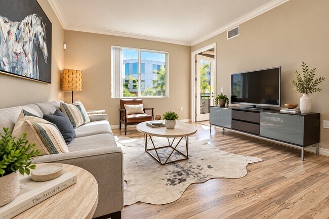 Elevate your living space at The Pointe with this inviting living room design. Bright and airy, it features modern furnishings and natural light, perfect for relaxation or entertaining. Schedule your tour today and envision your new lifestyle!