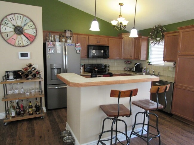 Photo - Spacious West-Side Home + 2-Car Garage + Fenced-in Yard! Available August 15th!