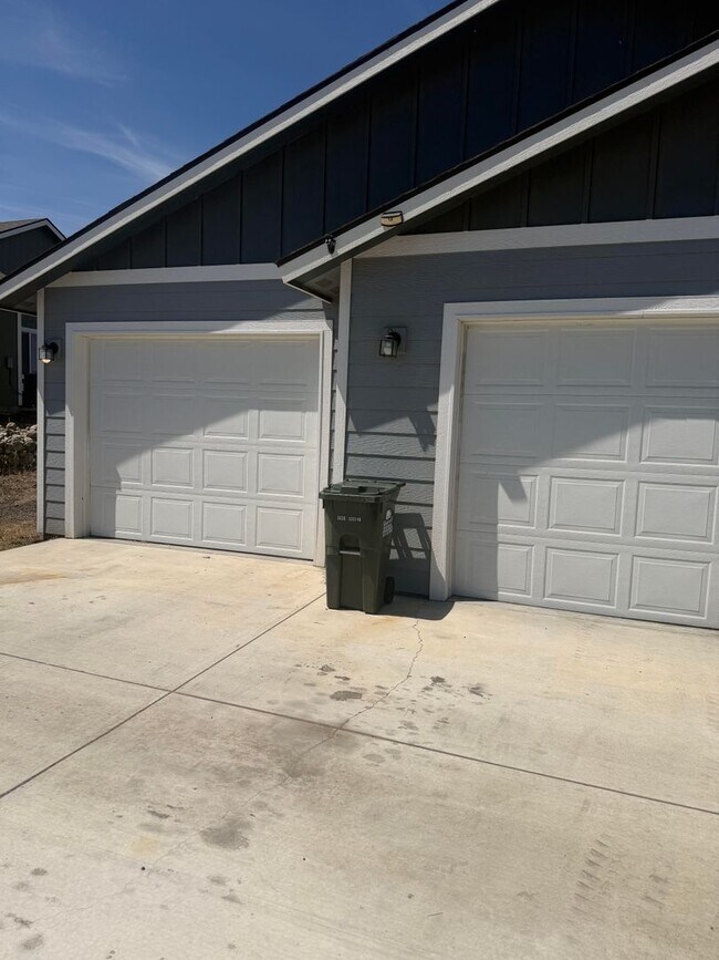 Photo - Lots of storage space in this 4- Car garage for all your playthings!!