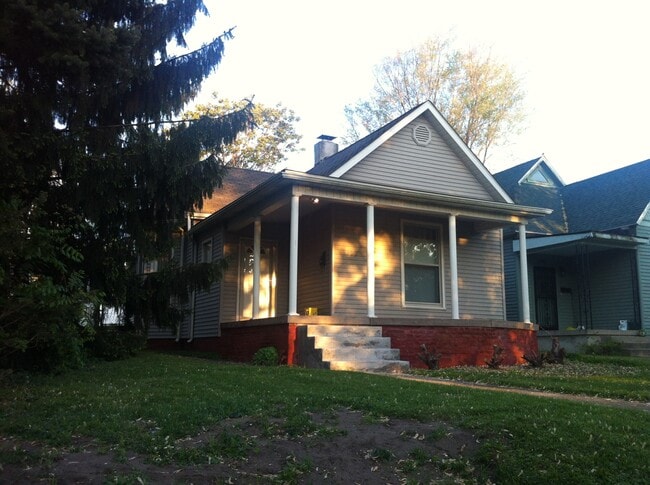 The front of the house is welcoming to visitors with it's covered porch. - 1445 South Center Street House