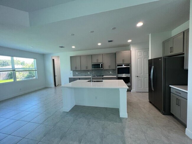 Photo - This Charming Brand-New Home is a 4/3 with...