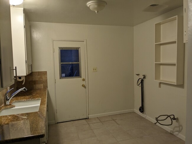 Kitchen with Stove, refrigerator and washer - 418 Real Rd Unit 418