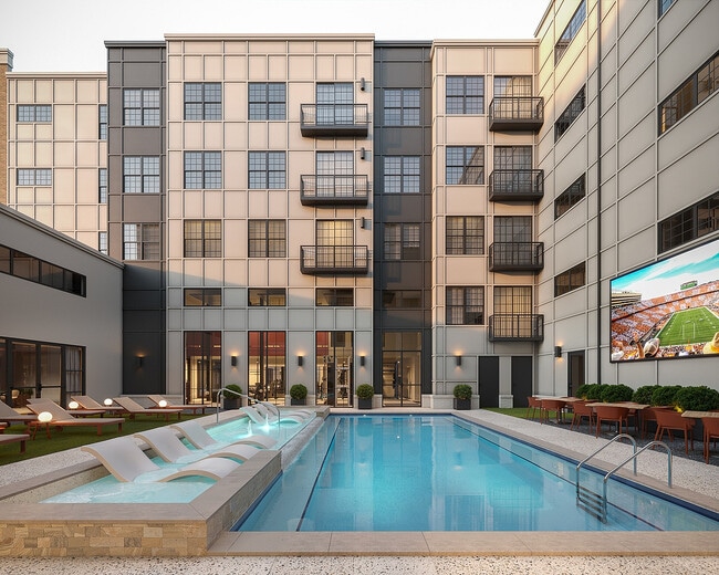 Resort-Style-Pool-with-Tanning-Shelf-Signature-on-Grand-Apartments-Near-UTK