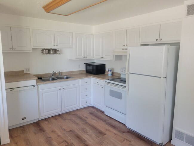 Kitchen with new flooring - 461 E 2650 N Unit Apartment #4