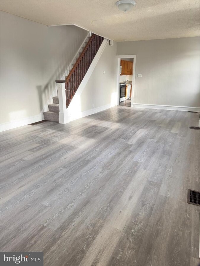Photo - Spacious 5-Bedroom Home with Private Yard & Off-Street Parking in Upland