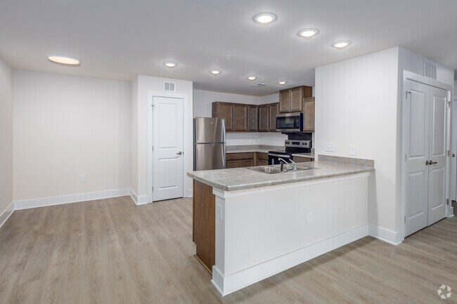3BR, 2BA - 1,318SF - Kitchen and Dining Area