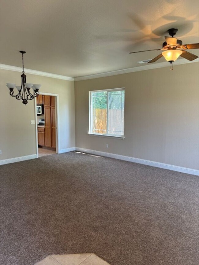 Photo - Enterprise Neighborhood 3 Bedroom Home with bonus room and 3 car garage- Landscaping Included!