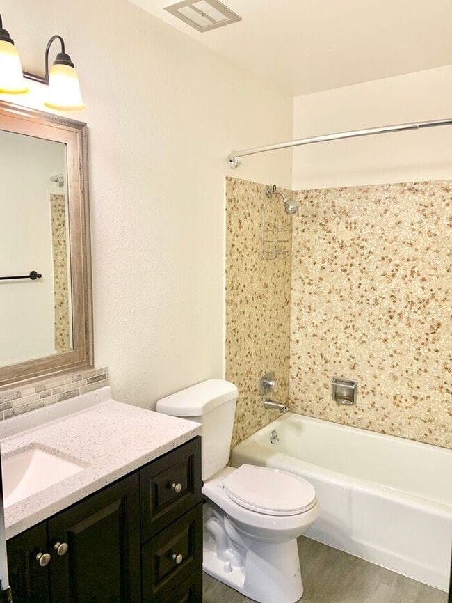 Photo - Spacious 2-Bedroom Apartment with Massive Private Deck, Covered Parking & Utilities Included!