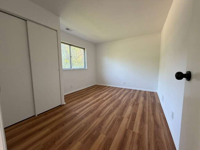 Photo - Spacious 4-Bedroom Home with Functional Layout, Backyard Access & Attached Garage
