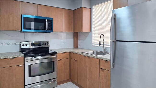 Building Photo - 6115 NW 186th St Unit 112 Rental